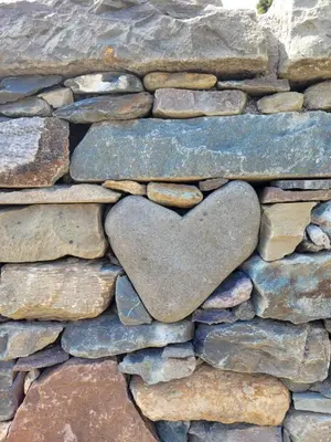 a heart shaped rock in a stone wall at Loch Lomond Blair Byre in Rowardennan