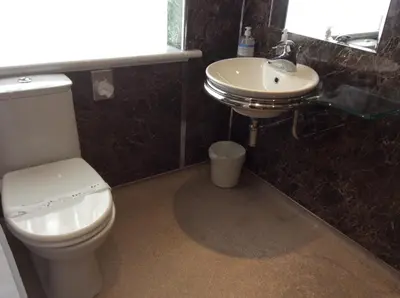 a bathroom with a white toilet and a sink at Auchenlea bed and breakfast in Coatbridge