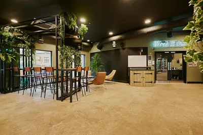 a restaurant with chairs and a bar in a room at For Students Only Modern studios in Glasgow West End in Glasgow