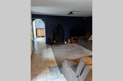 a living room with a couch and a fireplace at Glendyne Cottages, Highest Village in Scotland in Wanlockhead