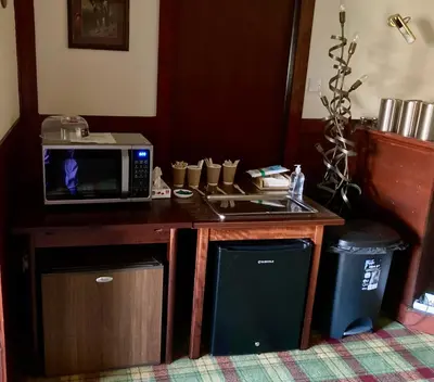 a kitchen with a microwave and a sink at Glenorchy Lodge Hotel-Rooms Only in Dalmally