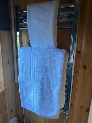 a pair of towels hanging on a towel rack at Couston Lakes Resorts in Bathgate