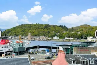 a view of a harbor with a cruise ship at No7 Oban Harbour in Oban