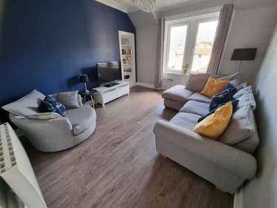 a living room with two couches and a television at No7 Oban Harbour in Oban