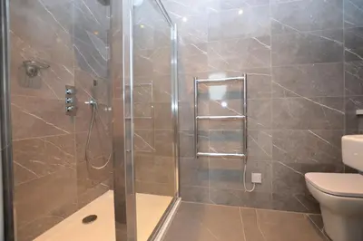 a bathroom with a shower and a toilet at Greenlea in Strachur