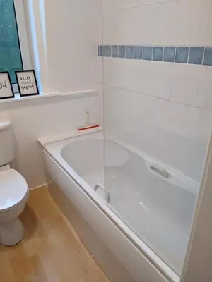 a bathroom with a shower and a toilet and a tub at Glenclova - No 5 Bellyeoman, bright two bedroom apartment in Fife