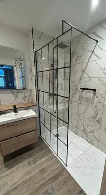 a bathroom with a shower and a sink at Glasgow Harbour Clyde Waterfront Apartment in Glasgow