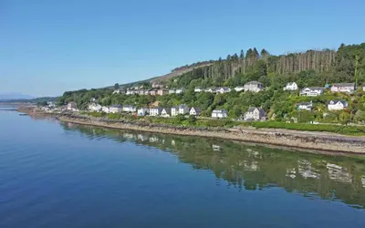 an aerial view of a river with houses at Arthur's Seat in Innellan