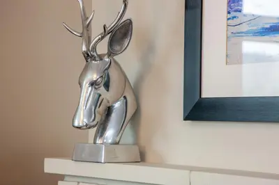 a metal trophy of a reindeer on a shelf at Island View in Oban
