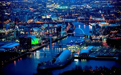 a view of a city at night at Glasgow City Centre G1 PENTHOUSE with RiverViews - Duplex - 4 Bedrooms, 3 Bathrooms, Kitchen, 1 Living room, 1 Dining room, 2 Terraces, Parking, Top Floor, 2050 sq ft, Merchant City in Glasgow