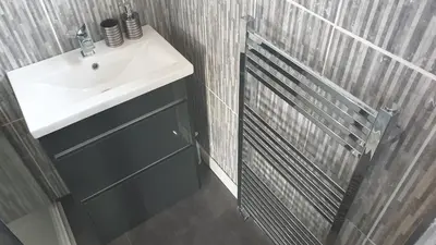 a bathroom with a white sink and a shower at Holiday Apartment, Balloch, Loch Lomond in Balloch