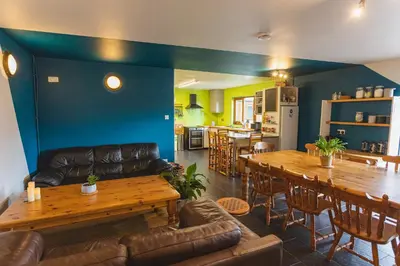 a living room with a couch and a table at Highland Basecamp in Lochaline