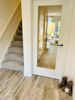 two teddy bears sitting on the floor in a hallway with a mirror at Glasgow City Central Executive Triplex House, 3 Bedroom 3 Bathrooms 1 living room Kitchen - Huge Terrace for Master Bedroom - Private E Parking LEZ Congestion Zone Free - Garden - 5 mins drive to City Centre Central Station in Glasgow