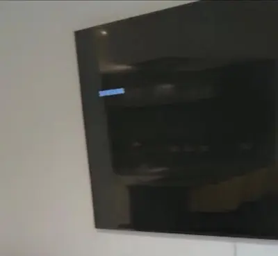 a close up of a black tv on a wall at Glasgow City Central Executive Triplex House, 3 Bedroom 3 Bathrooms 1 living room Kitchen - Huge Terrace for Master Bedroom - Private E Parking LEZ Congestion Zone Free - Garden - 5 mins drive to City Centre Central Station in Glasgow