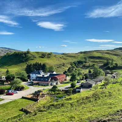 a small town in the middle of a green hill at Cologin in Oban