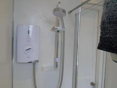 a shower in a bathroom with a shower at Snug - Tearlag Apartment in Helensburgh