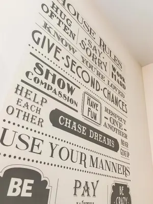 a wall filled with signs on a wall at Glasgow City Centre Studio Apartment in Glasgow
