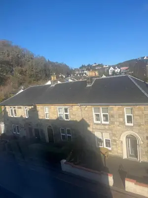a large brick building with a roof at DunMoore Guesthouse in Oban