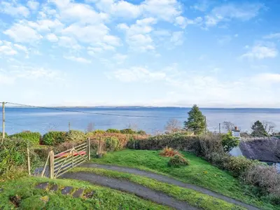 a set of stairs leading down to the water at The Creagan in Corrie