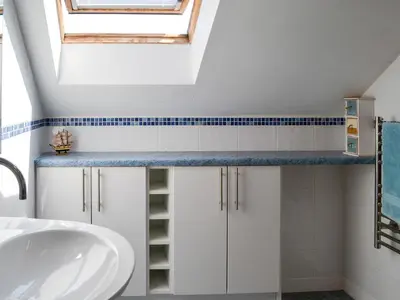 a bathroom with a sink and a skylight at Westlin in Penpont