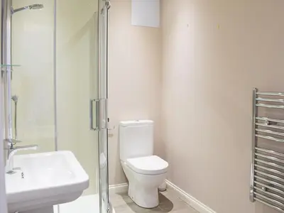 a bathroom with a toilet and a sink and a shower at Forth View-Uk34217 in Aberfoyle