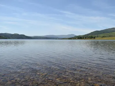 a large body of water with mountains in the background at Forth View-Uk34217 in Aberfoyle