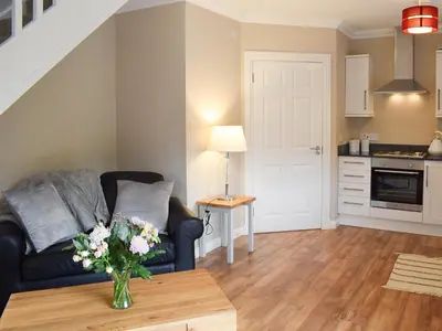 a living room with a couch and a table at Faodail-Uk34218 in Aberfoyle