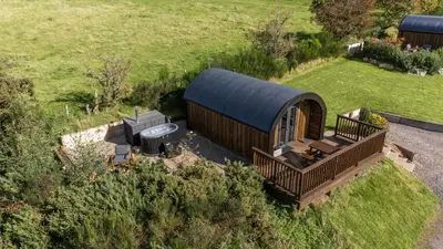an overhead view of a small cabin in a field at Luxury Glamping Pods - The Heft & The Hirsel in Glasgow