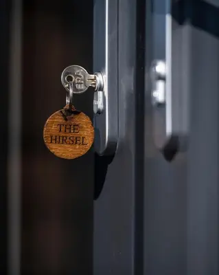 a lock on a door with the himself written on it at Luxury Glamping Pods - The Heft & The Hirsel in Glasgow