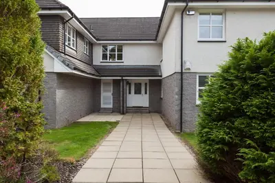 a house with a walkway in front of it at 3 bedroom Windsor Garden apartment by Gleneagles in Blackford
