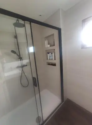 a shower with a glass door in a bathroom at Single bedroom in quiet neighbourhood in Mount Vernon