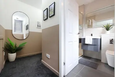 a bathroom with a sink and a mirror at JOIVY Modern 1 bed Flat in West End, close to Princes Gardens in Edinburgh