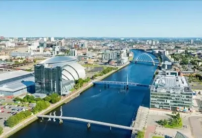 an aerial view of a river with a bridge at Central Glasgow Apt - Sleeps 2 & FreeParking During Weekend in Glasgow