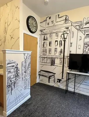 a room with a wall with a drawing of a city at Central Glasgow Apt - Sleeps 2 & FreeParking During Weekend in Glasgow
