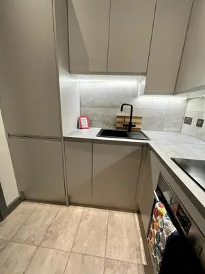 a small kitchen with a sink and a counter at 1 bed Apt in West End in Glasgow