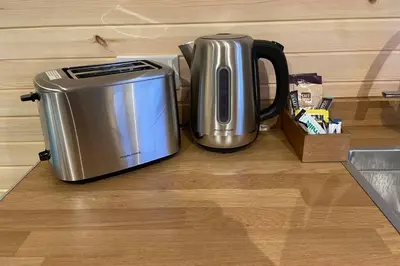 a metal appliance sitting on top of a kitchen counter at Sea Breeze Pod in Fort William