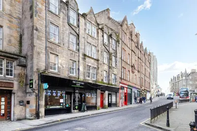 a street with buildings on a city street at JOIVY Charming Home with Patio Nearby the Castle in Edinburgh