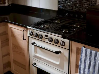 a kitchen with an oven with a stove top at Cozy two bed flat near Glasgow Airport & Paisley - Pass the Keys in Paisley