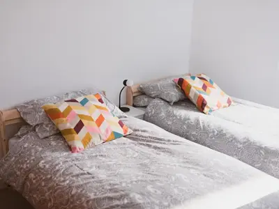 two beds sitting next to each other with pillows on them at Lovely 2-Bed Flat Glasgow Harbour FREE parking - Pass the Keys in Glasgow