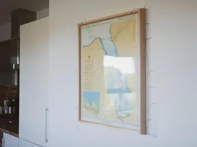 a map hanging on a wall in a kitchen at Lovely 2-Bed Flat Glasgow Harbour FREE parking - Pass the Keys in Glasgow