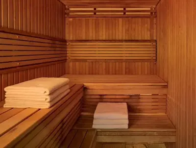 a sauna with two stacks of towels in it at Ryder Cup Lodge Duchally - Free access to Leisure Club Swimming Pool Hot Tub Steam Room - Starlink Satellite Internet - Sky Glass Now DOG FRIENDLY for 2025 in Auchterarder