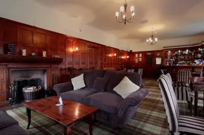 a living room with a couch and a fireplace at Ryder Cup Lodge Duchally - Free access to Leisure Club Swimming Pool Hot Tub Steam Room - Starlink Satellite Internet - Sky Glass Now DOG FRIENDLY for 2025 in Auchterarder