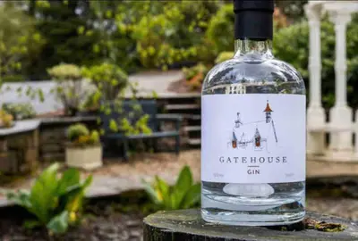 a bottle of wine sitting on top of a table at Ryder Cup Lodge Duchally - Free access to Leisure Club Swimming Pool Hot Tub Steam Room - Starlink Satellite Internet - Sky Glass Now DOG FRIENDLY for 2025 in Auchterarder