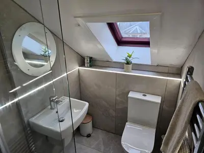 a small bathroom with a sink and a mirror at Welcome to St Helena Dunoon, a traditional villa in Dunoon
