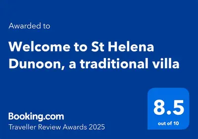a blue sign with the text welcome to st helena dunedin a traditional village at Welcome to St Helena Dunoon, a traditional villa in Dunoon