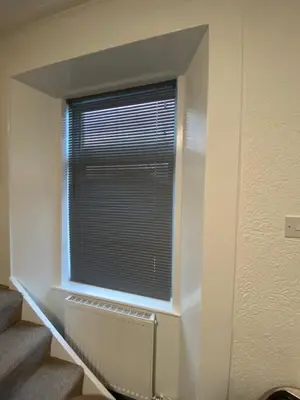 a window in a room with a radiator and stairs at Glenashdale 28 A 1/R Boyd Street Largs KA308LE in Largs