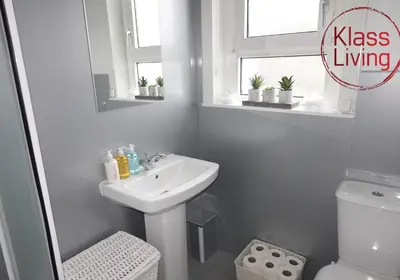 a white bathroom with a sink and a toilet at Welsh Drive Apartment by Klass Living Blantyre in High Blantyre