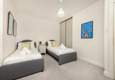 a bedroom with two beds in a room at The Old Bakery in Edinburgh