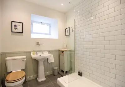 a bathroom with a toilet and a sink and a shower at The Old Bakery in Edinburgh