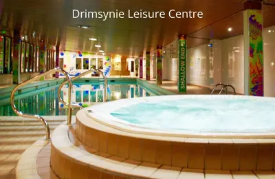 a swimming pool with a large tub in a building at Hollybank Cottage in Lochgoilhead